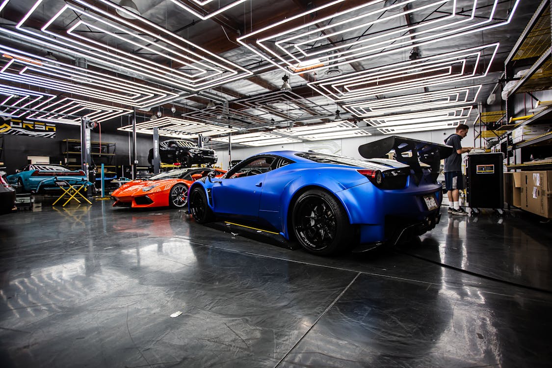 Performance cars inside a professional automotive workshop garage in Mooresville, North Carolina - Race City USA