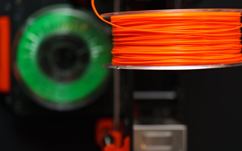 Close-up of colorful 3D printing filament spools