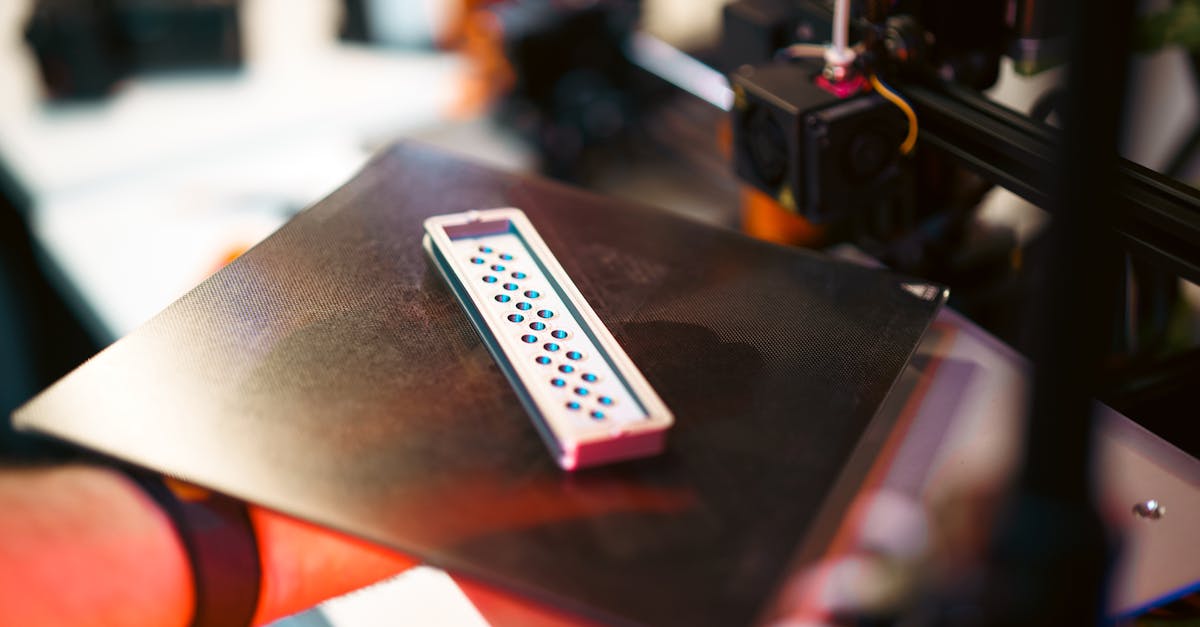 Multi-material 3D printed part showing different material zones with varied colors and properties